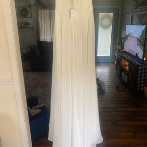 Ivory wedding gown with train. From David’s bridal